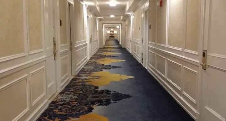 Interiors: Corridor of the Drake Hotel, Chicago, Illinois.